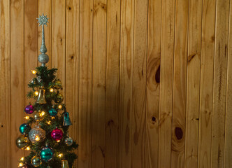 Closeup shot of a Christmas tree with shiny decorations