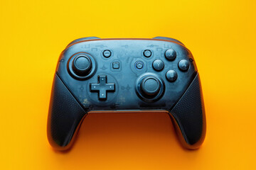 Computer gaming competition. Gaming concept. Black joystick on orange background.