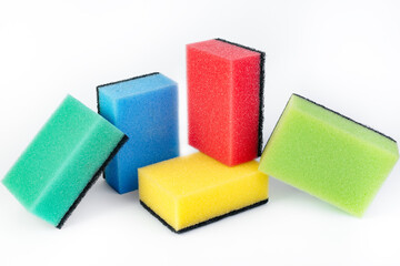 Photo of colorful dishwashing sponge stack on white background.