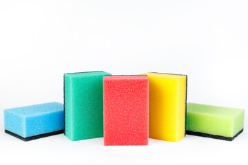 Photo of colorful dishwashing sponge stack on white background.