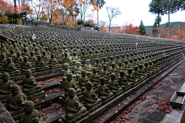 sculptured stone statues of Jizo in queues in Fukuoka, Japan 