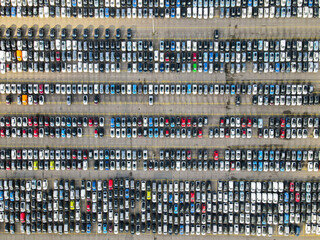 Aerial shot of parked cars in a structured row parking lease cars new production industry
