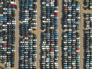 Fototapeta na wymiar Aerial shot of parked cars in a structured row parking lease cars new production industry