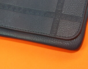 blue purse on orange background