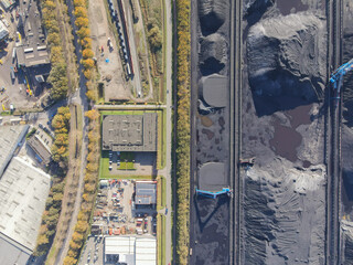 Fototapeta premium Coal storage place energy consumption piles of black coal