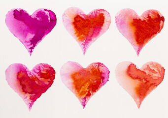 Watercolor painted pink heart, on the white watercolor paper.