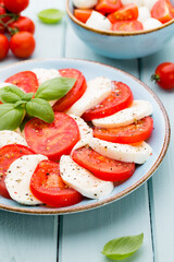 Classic caprese salad. Mozzarella tomatoes and  Basilikum.