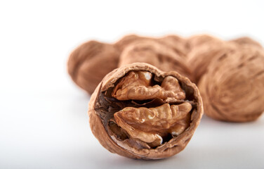 Walnuts in close-up, isolated on a white background.Space for text