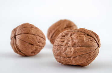 Walnuts in close-up, isolated on a white background.Space for text