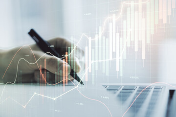 Double exposure of abstract creative financial diagram with hand writing in notebook on background,...