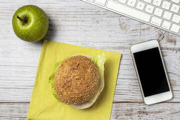 Lunch at work place healthy sandwich on work table