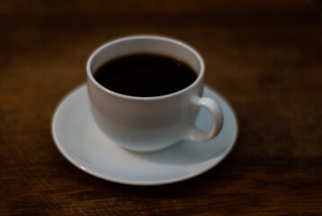 cup of coffee on wooden table