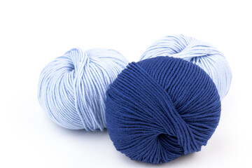woolen merinos blue threads on white background. natural wool. knitting. background