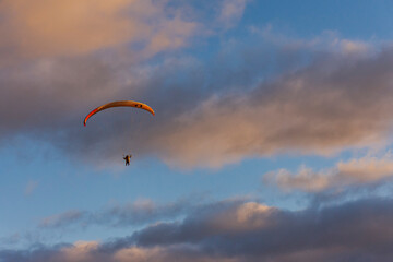 Low angle view of paraglider against sky with clouds in Esquel, Patagonia, Argentina