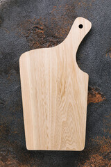 Empty cutting board on the table, top view. Food background