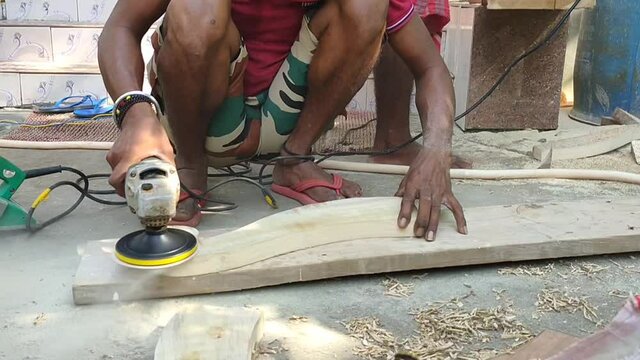Agartala India : 05 Aug 2020 - A  Indian carpenter making beautiful wooden work piece.