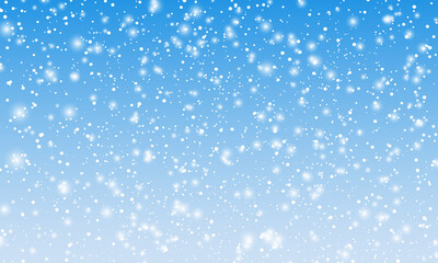 Snow background. Winter snowfall. White snowflakes on blue sky. Christmas background. Falling snow.
