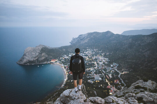 Italy, Liguria, La Spezia, Man looking at mountain range from mountain top