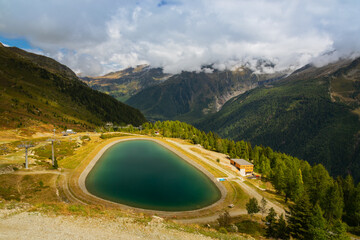 European mountains Mont Blanc, France. Near the town of Chamonix, Haute-Savoie. A beautiful emerald mountain lake.