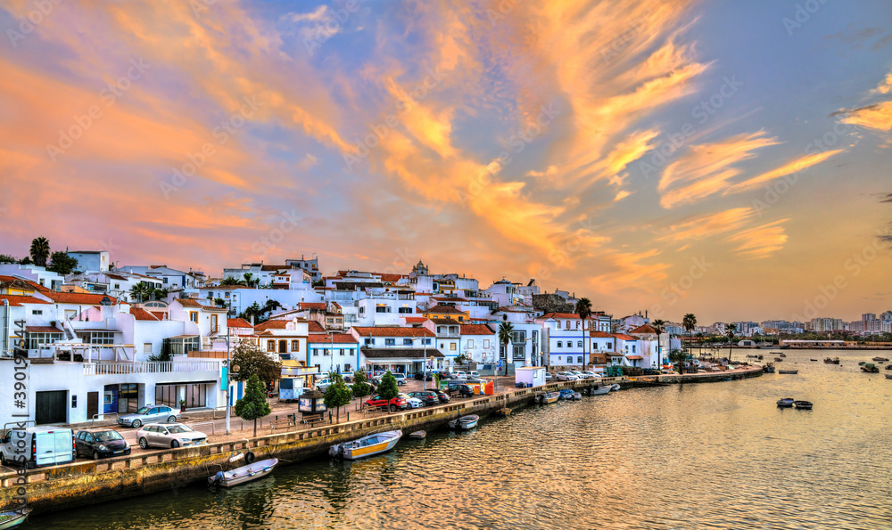 Wall mural ferragudo, a traditional fishing village at sunset. algarve, portugal