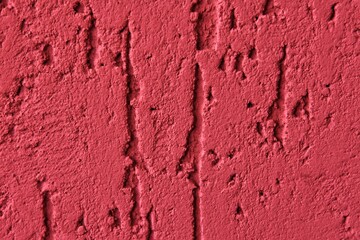Fototapeta premium Red abstract backdrop with deep scratches. texture cement background. Painted surface with bark beetle effect. Concrete wall