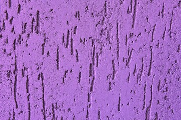 Violet abstract backdrop with deep scratches. texture cement background. Painted surface with bark beetle effect. Concrete wall