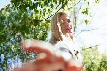 Young adult woman spending quality time in the forest