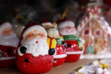 Christmas souvenirs, Santa Claus figurines. New Year gifts in a shop