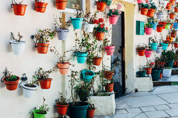 Street decorated with pots and flowers