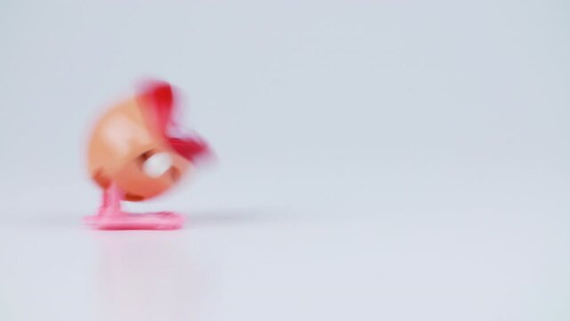 Shooting of jumping teeth - moving toy on white background