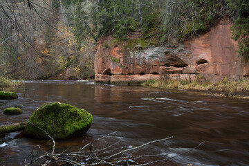 City Cesis, Latvia. Rapid river with stones and trees. Natural flora.Travel photo.