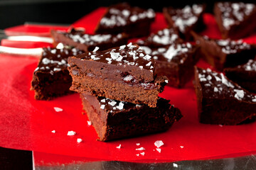 Close up of shortbread ganache bars served on red paper
