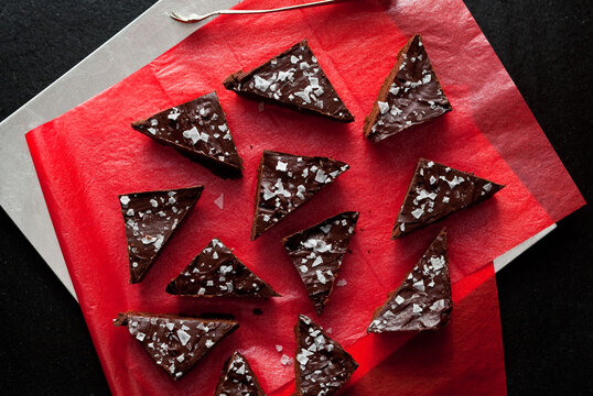Overhead view of shortbread ganache bars served on red paper