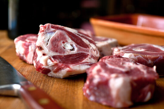 Close up of lamb necks braised in wine with pepper
