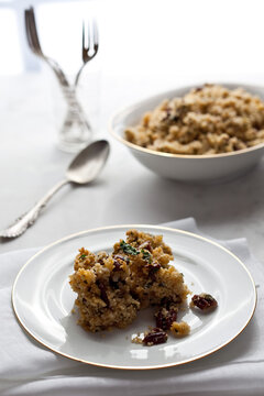 Close up of lemony couscous and pecan with parsley and garlic served on plate