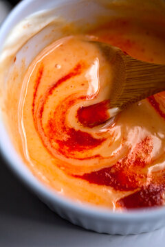 Close up of maple mayonnaise with sriracha sauce in bowl