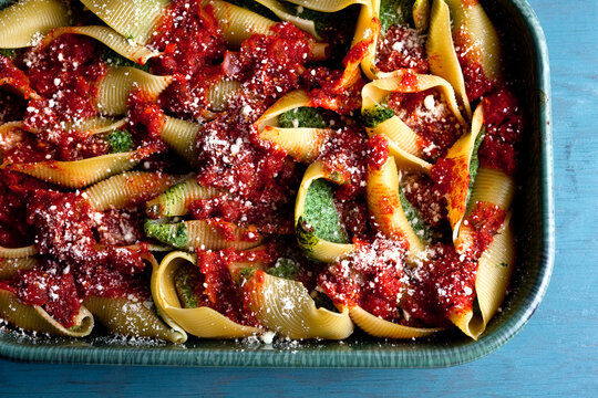 Overhead view of shells pasta with spinach and ricotta