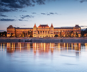 View on the riverbank of Budapest with the Budapest University of Technology and Economic at night