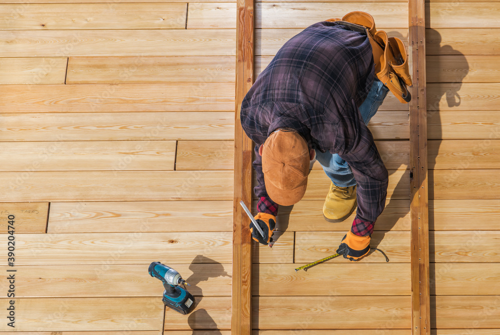 Wall mural men building wooden deck