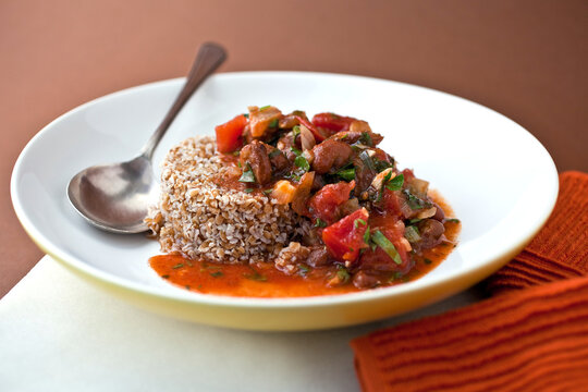 Close up of fava bean stew with bulgur served on plate