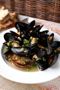 Creamy Mussels Stew With Peas, Fennel And Lemon Served On Plate