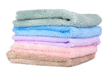 Different multicolor fluffy fabric towel isolated on the white
