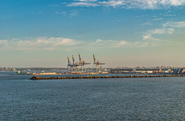 Montevideo, Uruguay- December 18, 2008: Cranes at shipping container terminal in port behind...
