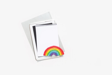 Top view of a flat lay of desktop and notepads for writing down goals and plans. 2021 New Year's goal, plan, action text on notepad with office accessories. Business motivation, inspiration concept.