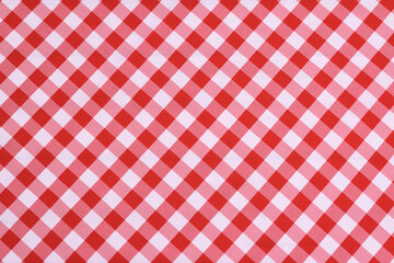 Red checkered textile picnic tablecloth pattern in close-up. Classic italian cuisine style.