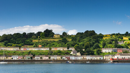 Fototapeta na wymiar Panoramic view of colorful houses in Monkstown on the banks of the River Lee and near Cork City in Ireland.