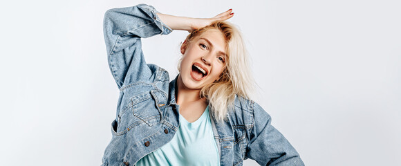 Beautiful happy young girl on gray isolated background