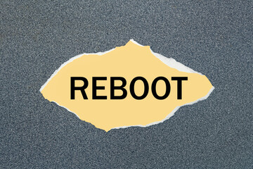 REBOOT - written on torn yellow paper.