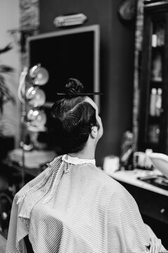 young man in a barber shop.