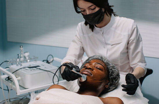 Apparat skincare procedure for afro-american woman